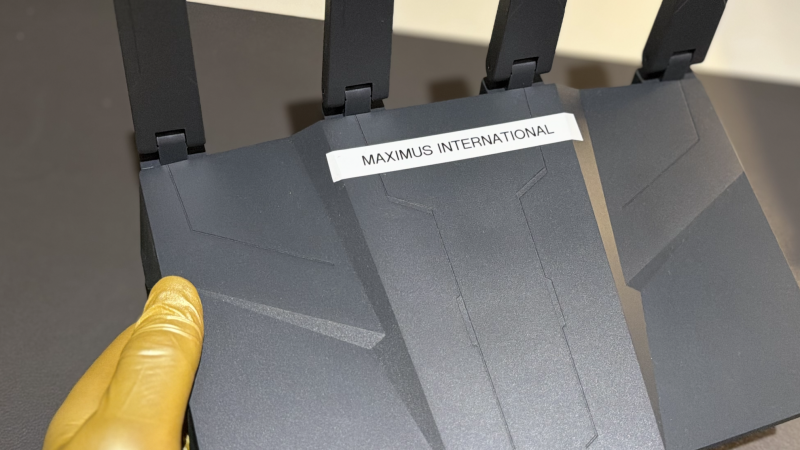 Cyber security specialist examining a router for advanced network threats